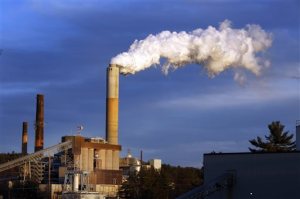 FILE - In this Jan. 20, 2015 file photo, a plume of steam billows from the coal-fired Merrimack Station in Bow, N.H.  President Barack Obama on Monday, Aug. 3, 2015, will unveil the final version of his unprecedented regulations clamping down on carbon dioxide emissions from existing U.S. power plants. The Obama administration first proposed the rule last year. Opponents plan to sue immediately to stop the rule's implementation. (AP Photo/Jim Cole, File)